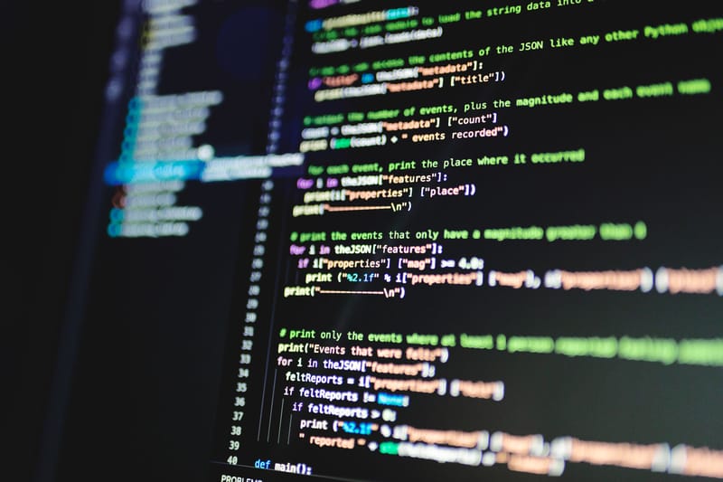 Lines of colorful programming code on a dark computer monitor